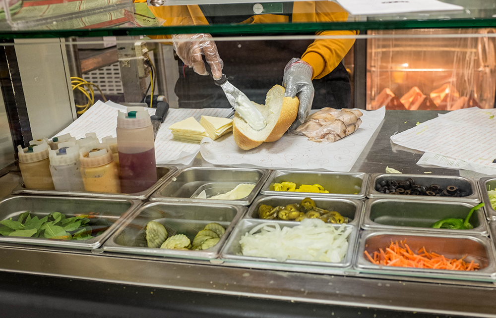 employee making sandwich